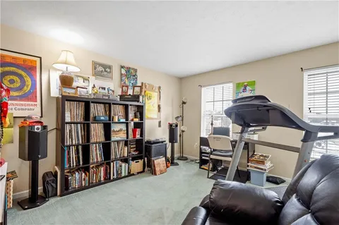a view of a livingroom with furniture and workspace