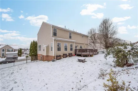 a view of a house with a snow in the yard