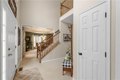 a view of entryway and hall with a livingroom