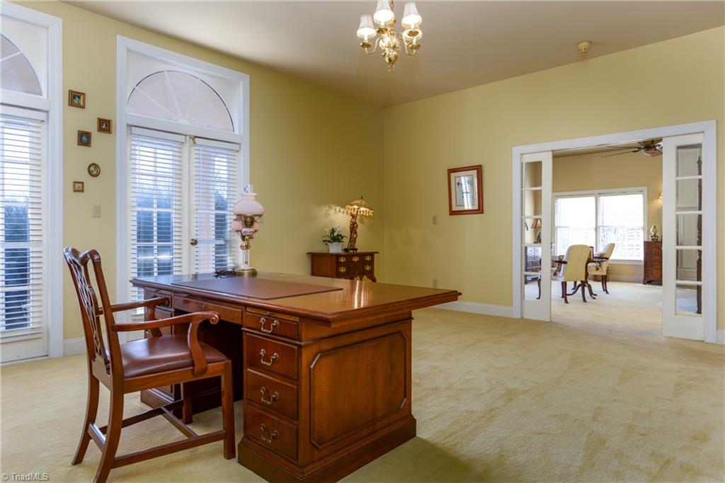 5529 Kennedy Road Trinity, NC 27370 - Photo 22 of 30 Endless possibilities flourish with the Master Bedroom sitting room. This space can be used as a personal office, library or reading nook. Paned glass pocket doors lead to the spacious Master Bedroom.