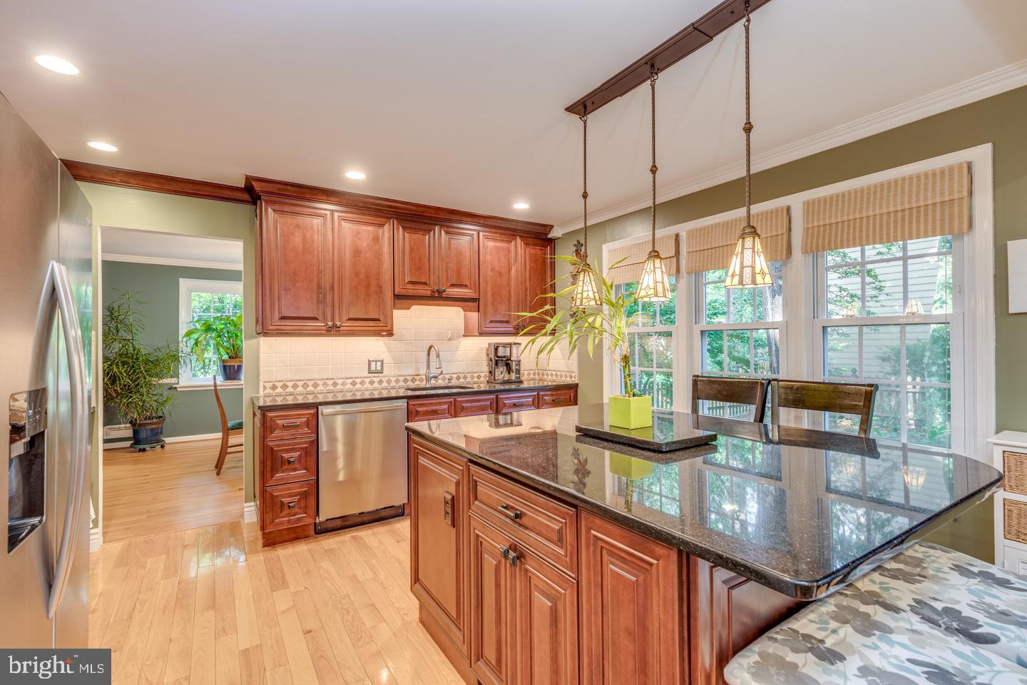 110 Wexford Drive Cherry Hill, NJ 08003 - Photo 14 of 51 a kitchen with stainless steel appliances granite countertop sink stove and wooden cabinets