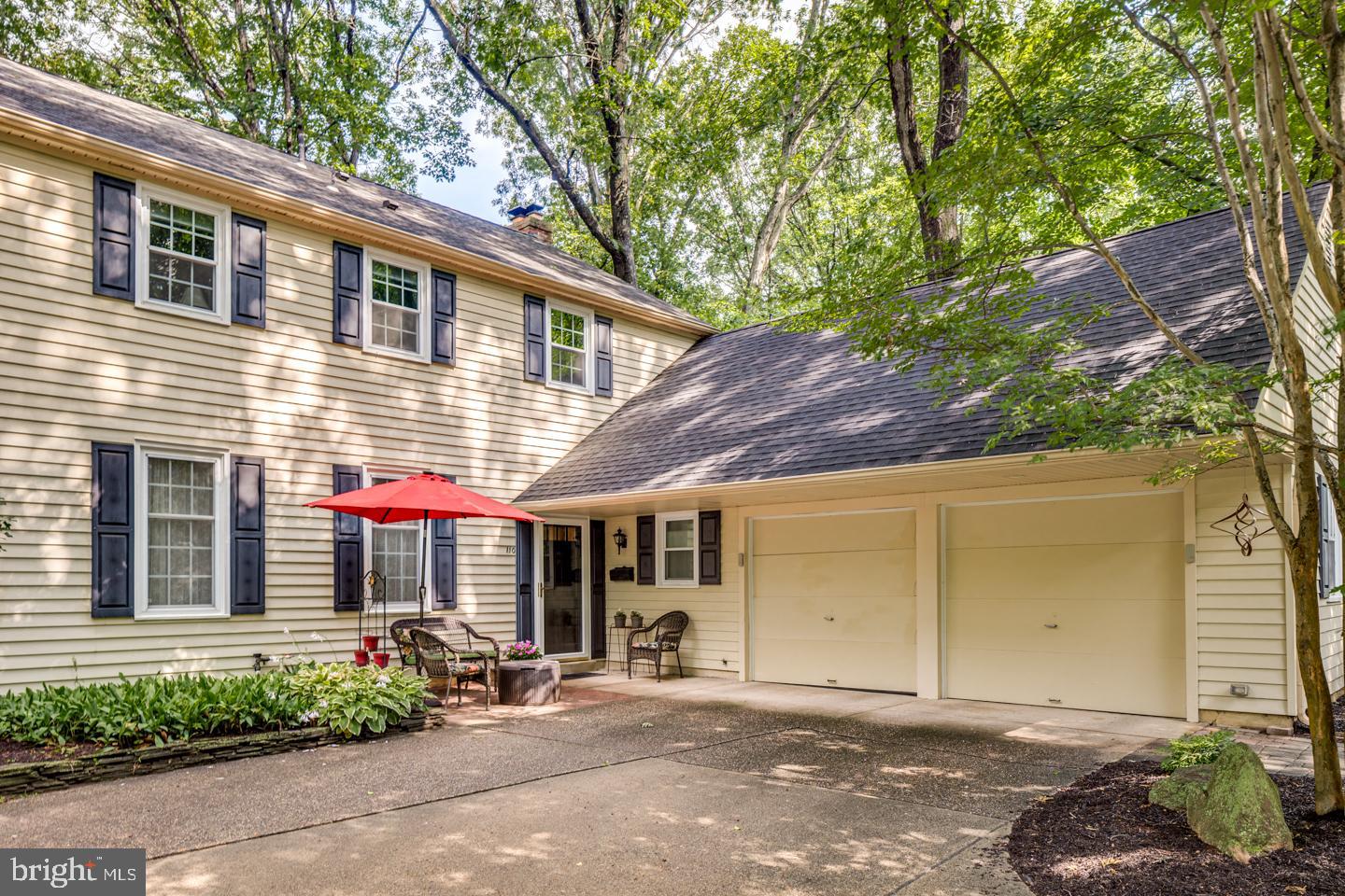 110 Wexford Drive Cherry Hill, NJ 08003 - Photo 2 of 51 a front view of a house with a yard and a garage