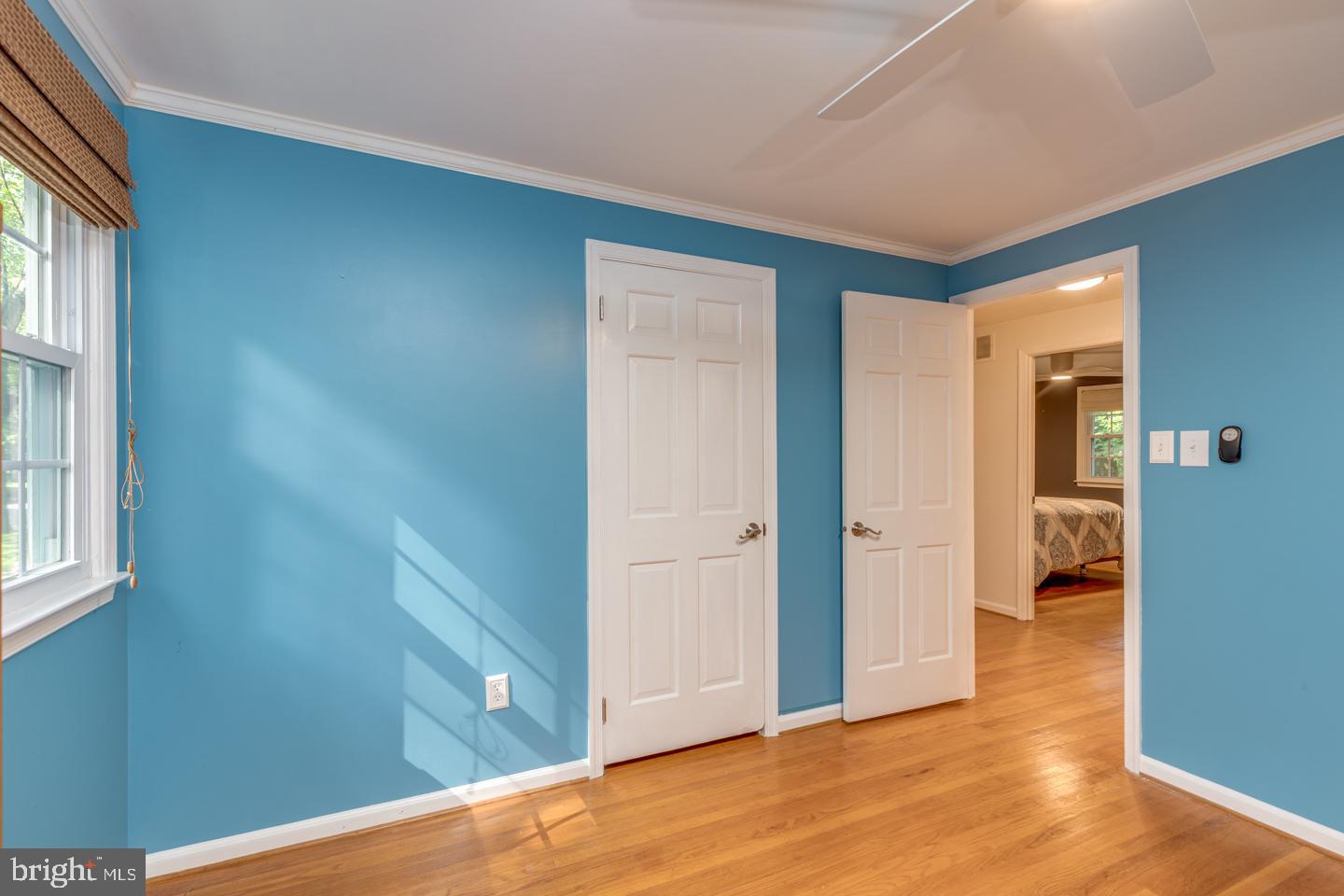 110 Wexford Drive Cherry Hill, NJ 08003 - Photo 27 of 51 an empty room with wooden floor and windows