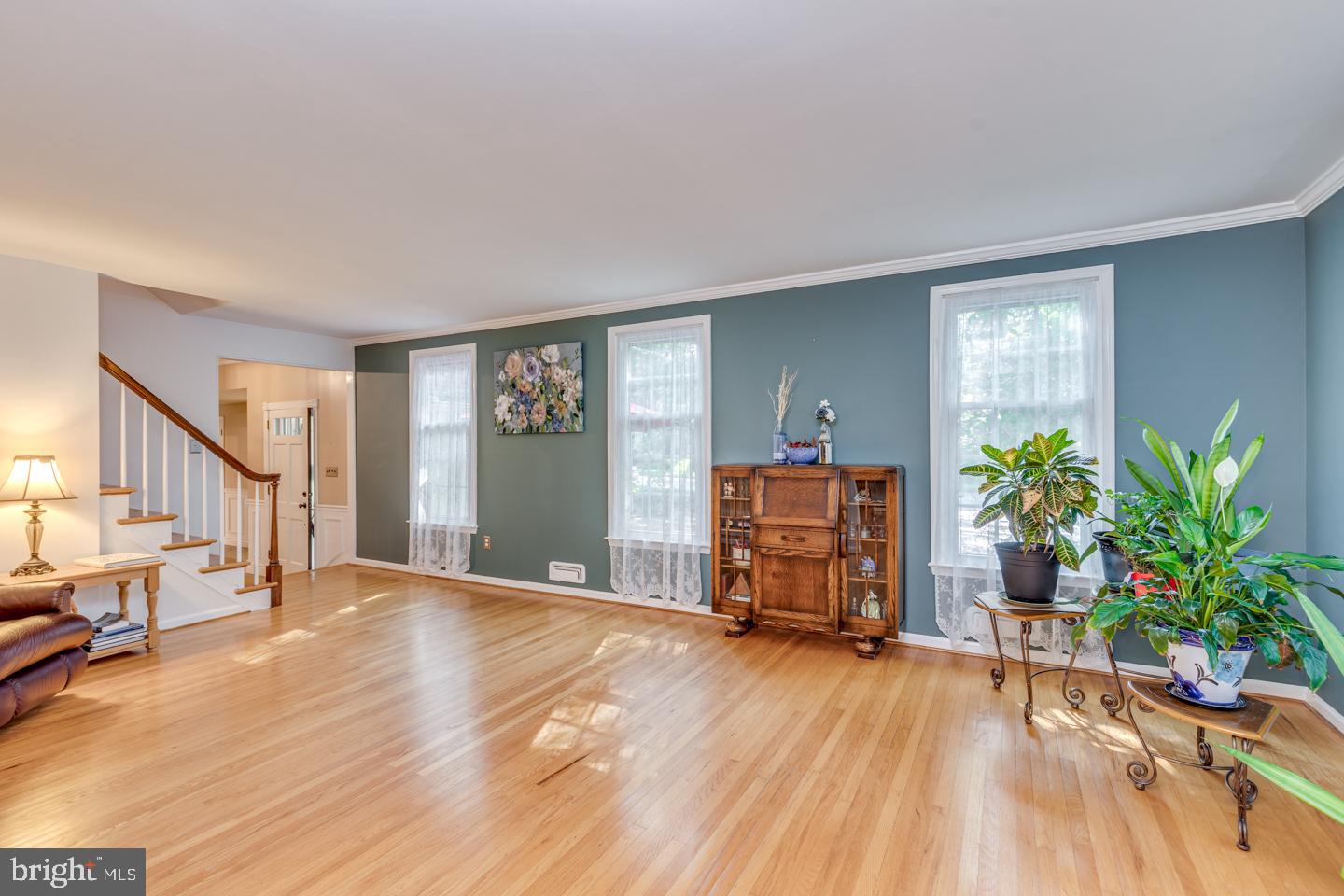110 Wexford Drive Cherry Hill, NJ 08003 - Photo 9 of 51 a view of an empty room with a window and wooden floor