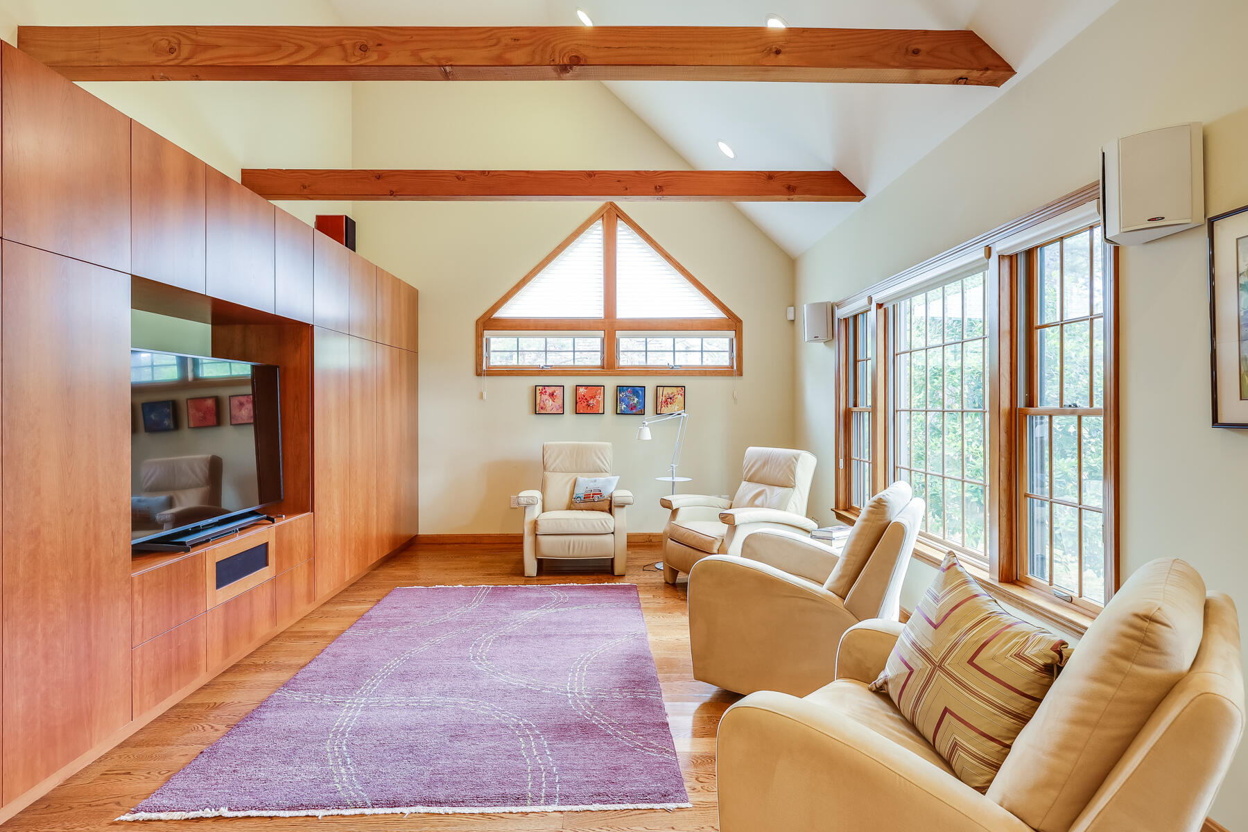 375 Eastwind Circle Wellfleet, MA 02667 - Photo 15 of 59 a living room with furniture floor to ceiling window and a flat screen tv