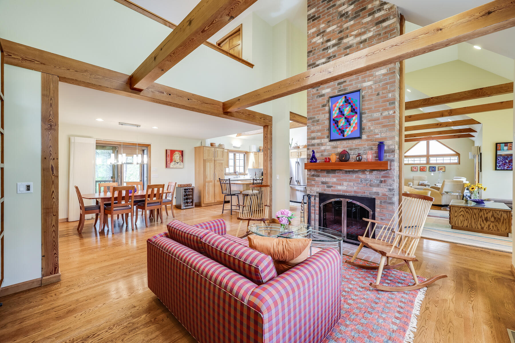 375 Eastwind Circle Wellfleet, MA 02667 - Photo 2 of 59 a living room with furniture and a fireplace