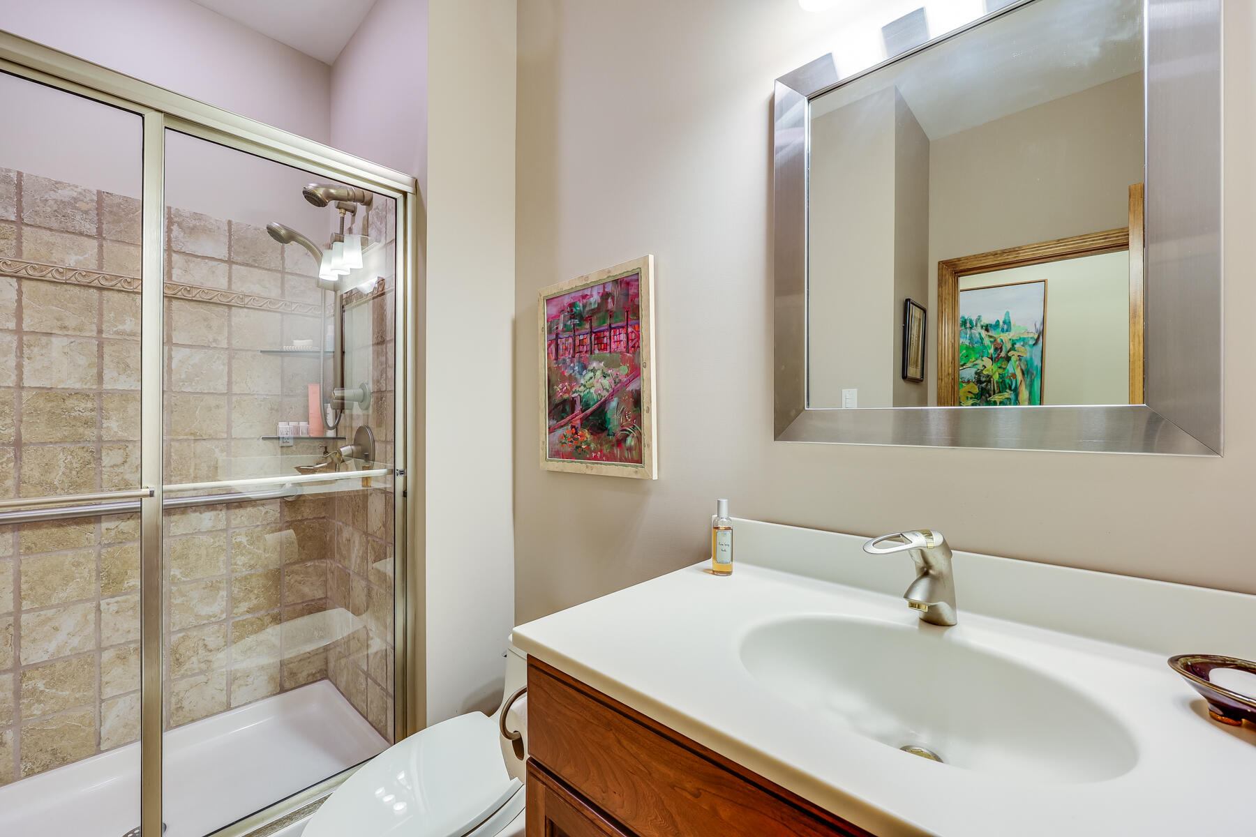 375 Eastwind Circle Wellfleet, MA 02667 - Photo 33 of 59 a bathroom with a sink and a mirror