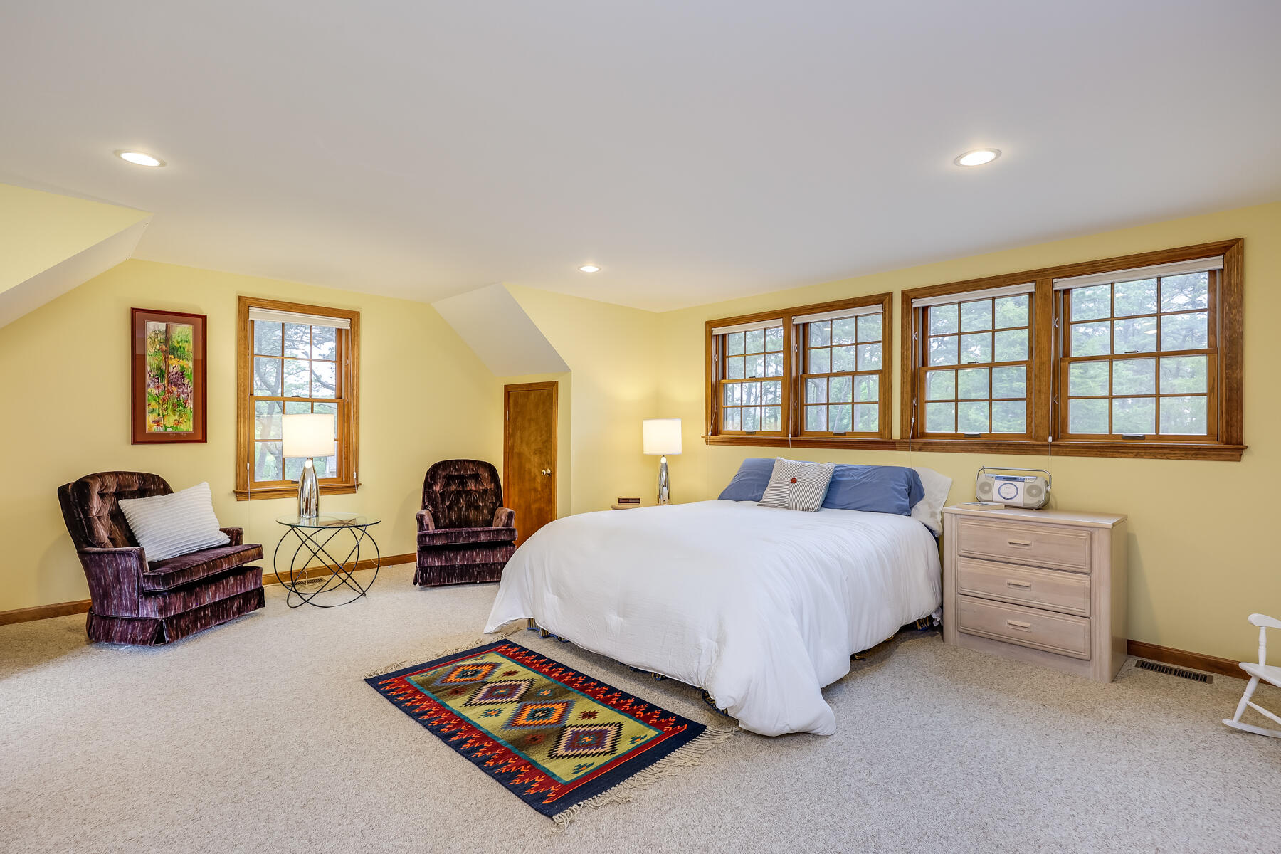 375 Eastwind Circle Wellfleet, MA 02667 - Photo 36 of 59 a bedroom with a bed a table and chair