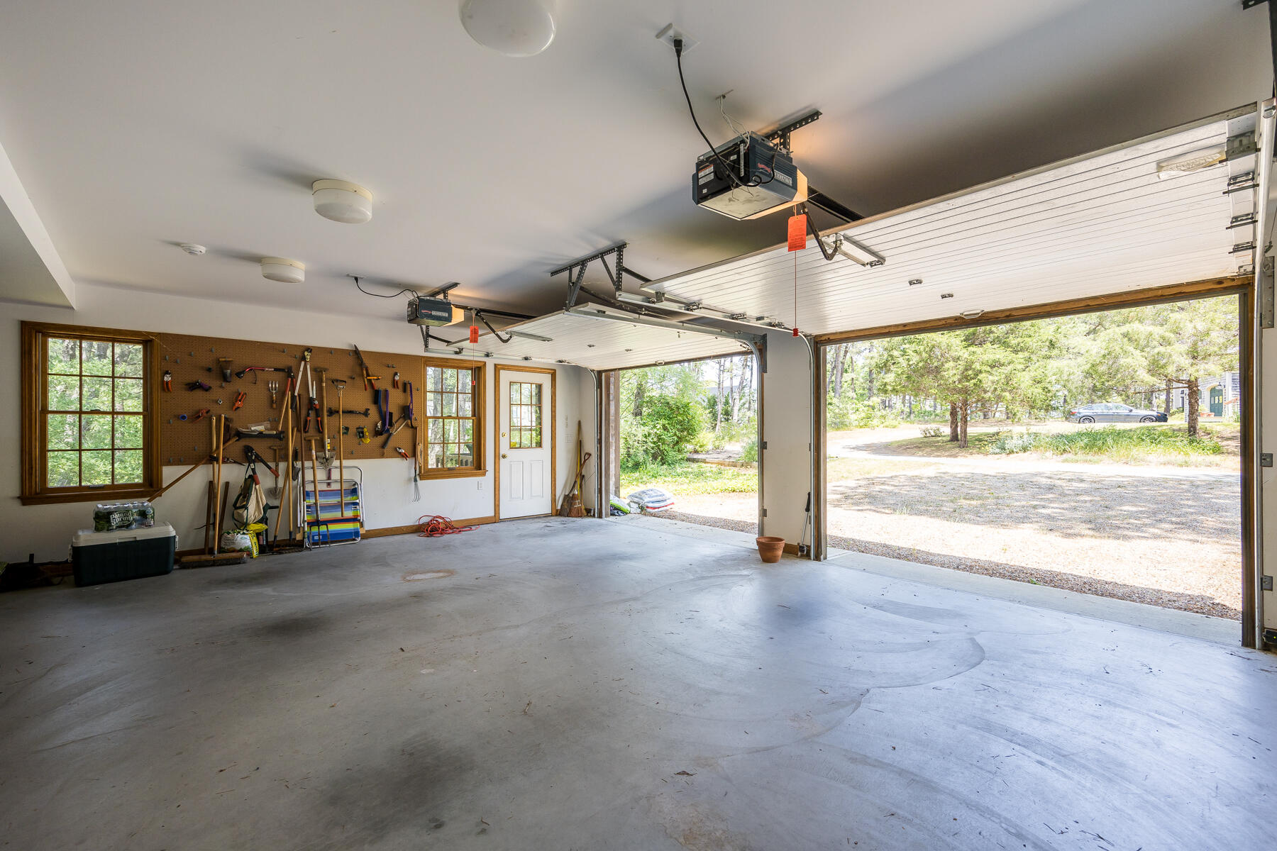 375 Eastwind Circle Wellfleet, MA 02667 - Photo 45 of 59 a view of empty room with wooden floor and fan