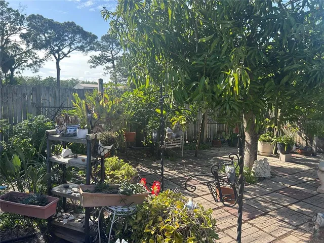 a view of a bench in the backyard