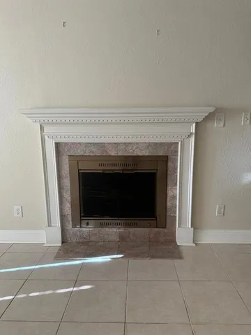 a kitchen with granite countertop white cabinets and stainless steel appliances