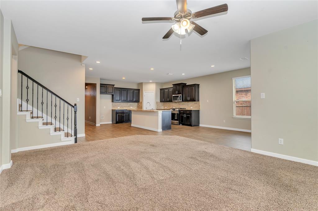 1102 Tiburon Trail Cleburne, TX 76033 - Photo 11 of 36 Unfurnished living room featuring ceiling fan, light colored carpet, and recessed lighting