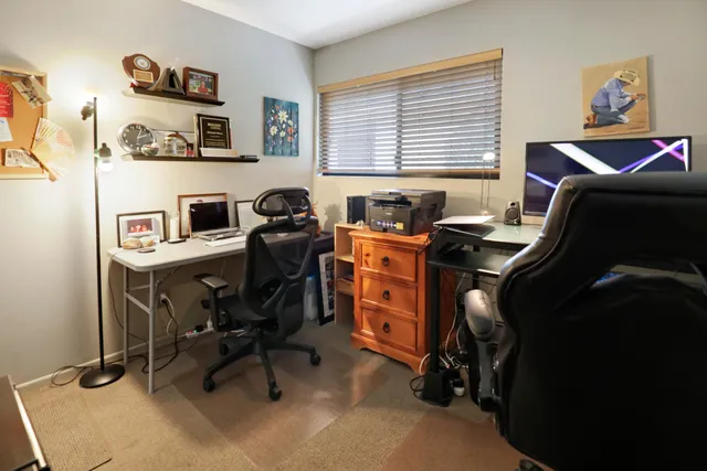 a view of a workspace with furniture