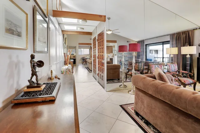 a living room with furniture gym equipment and a fireplace