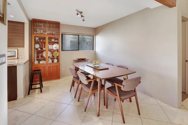 a view of a dining room with furniture and window