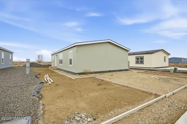 a large kitchen with cabinets and stainless steel appliances