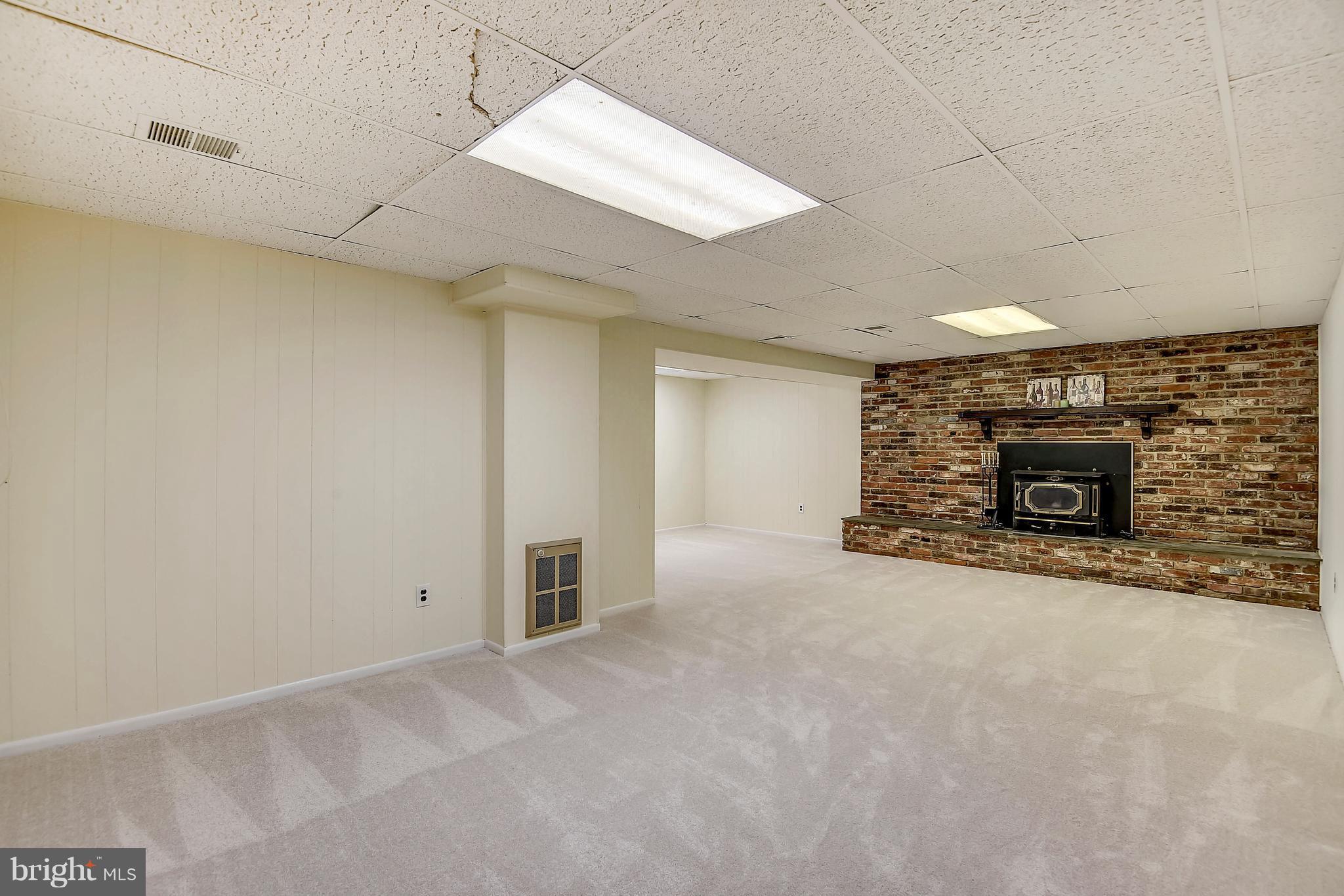 2113 Kings House Road Silver Spring, MD 20905 - Photo 23 of 30 HUGE LL REC ROOM W/NEW CARPET & WOOD STOVE