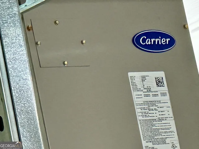 a picture of a table and chairs in the garden