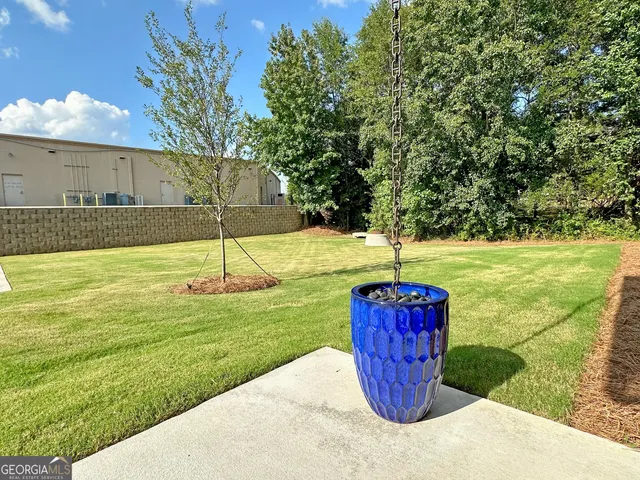 a view of a swimming pool with a yard