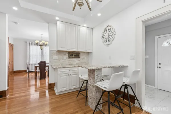 a bathroom with a sink mirror and toilet