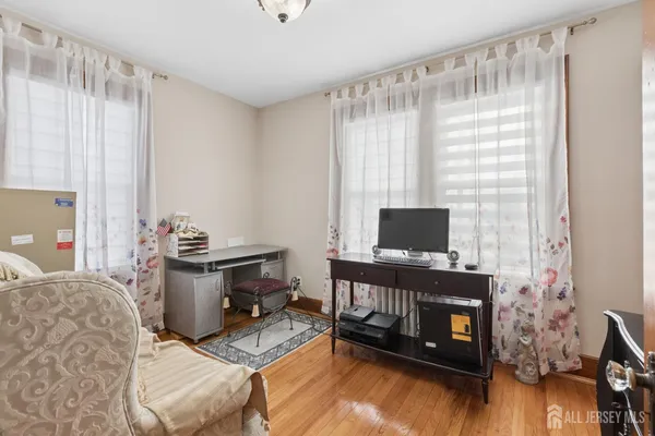 a bathroom with a granite countertop sink and a bathtub