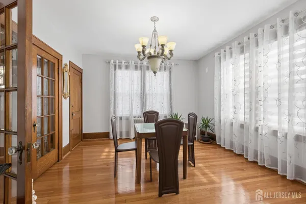 a kitchen with appliances cabinets and wooden floor