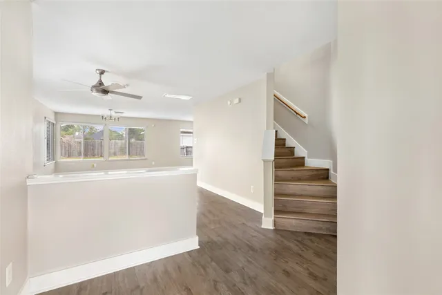 a view of entryway and hall with wooden floor