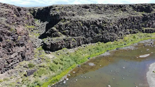 a aerial view of a house with a yard