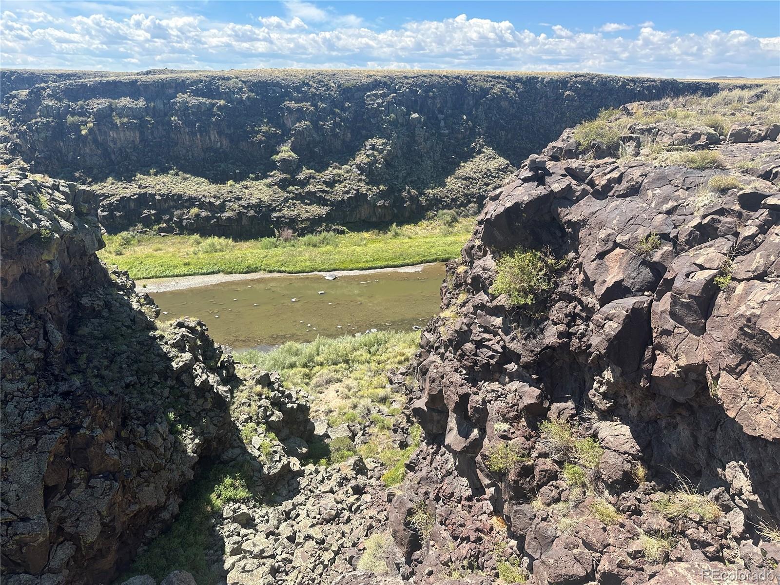 3946 County Rd B San Luis, CO 81152 - Photo 22 of 49 a view of a city of water with a building in the background
