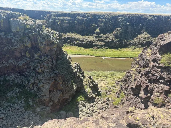 a view of a yard of the house and a mountain