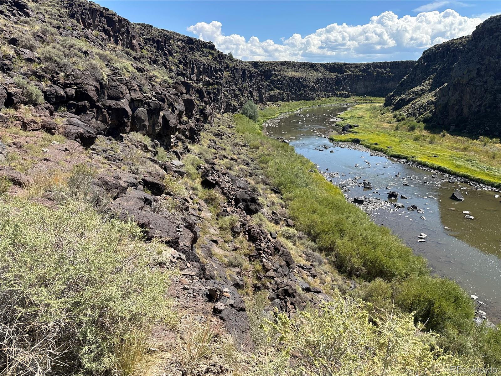 3946 County Rd B San Luis, CO 81152 - Photo 35 of 49 a view of a lake with a mountain