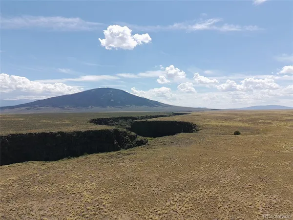 a view of ocean and mountain