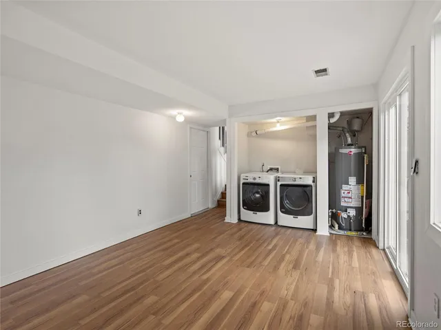 a view of a room with wooden floor