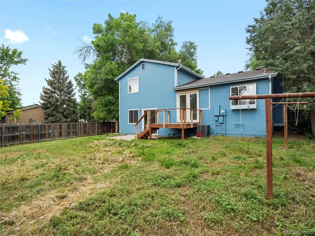 a house view with a backyard space