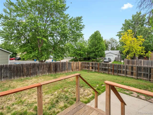a view of a wooden deck with a lake view