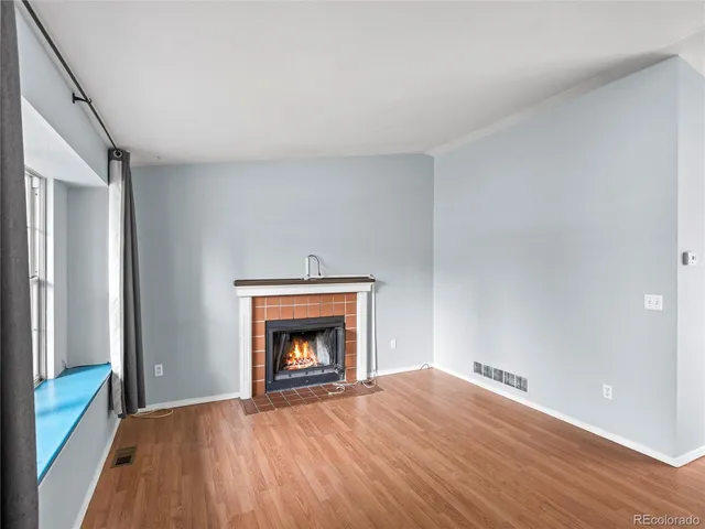a room with a fireplace and a fireplace