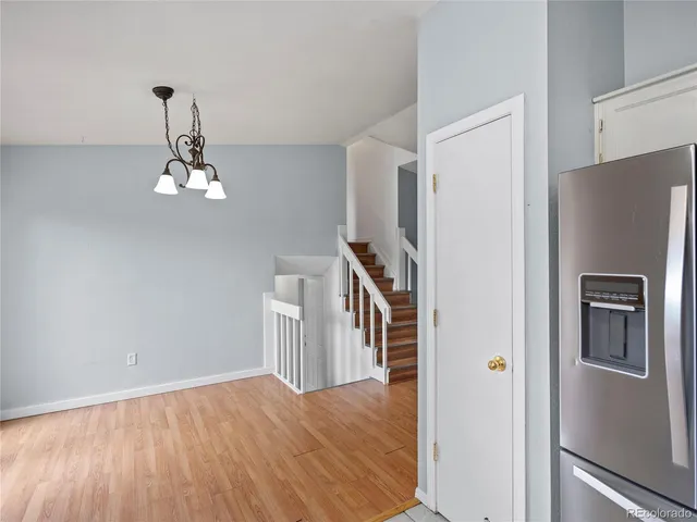 a very nice looking kitchen with a refrigerator