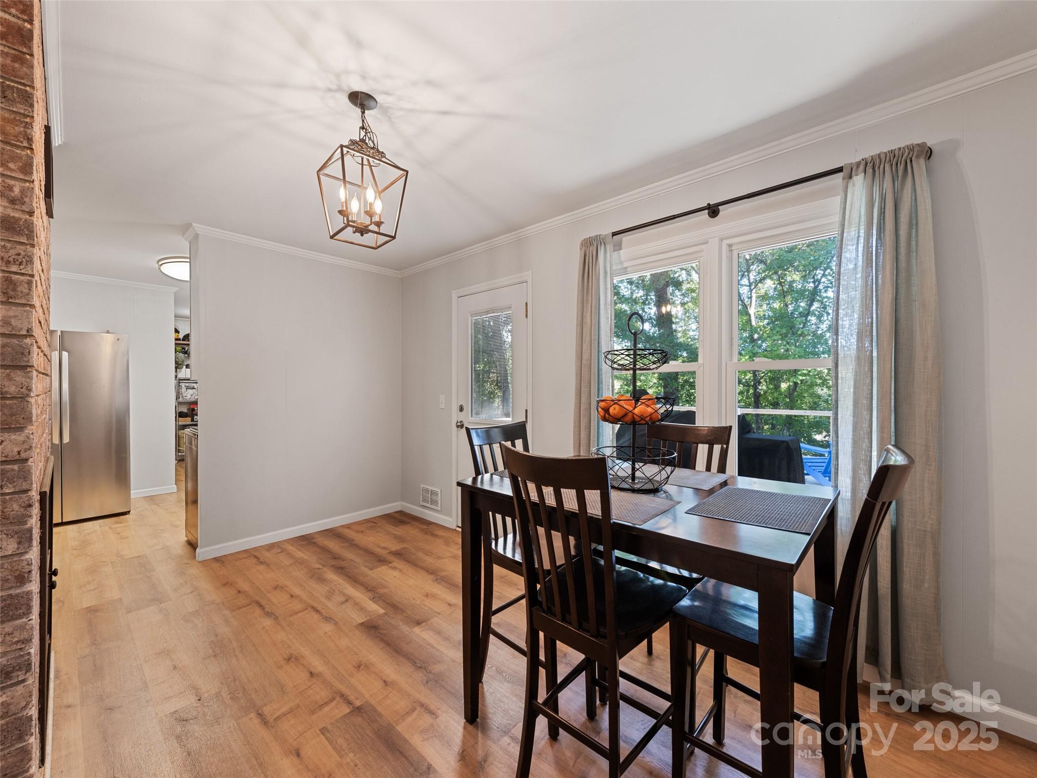 263 Blanton Street Columbus, NC 28722 - Photo 17 of 45 a view of a dining room with furniture window and outside view