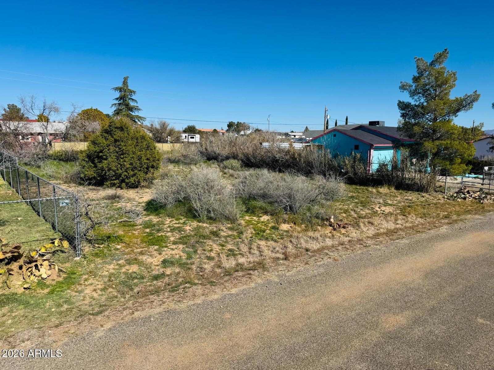 20126 East Antelope Road, Unit 1068 Mayer, AZ 86333 - Photo 2 of 6 a view of a street with a building in the background