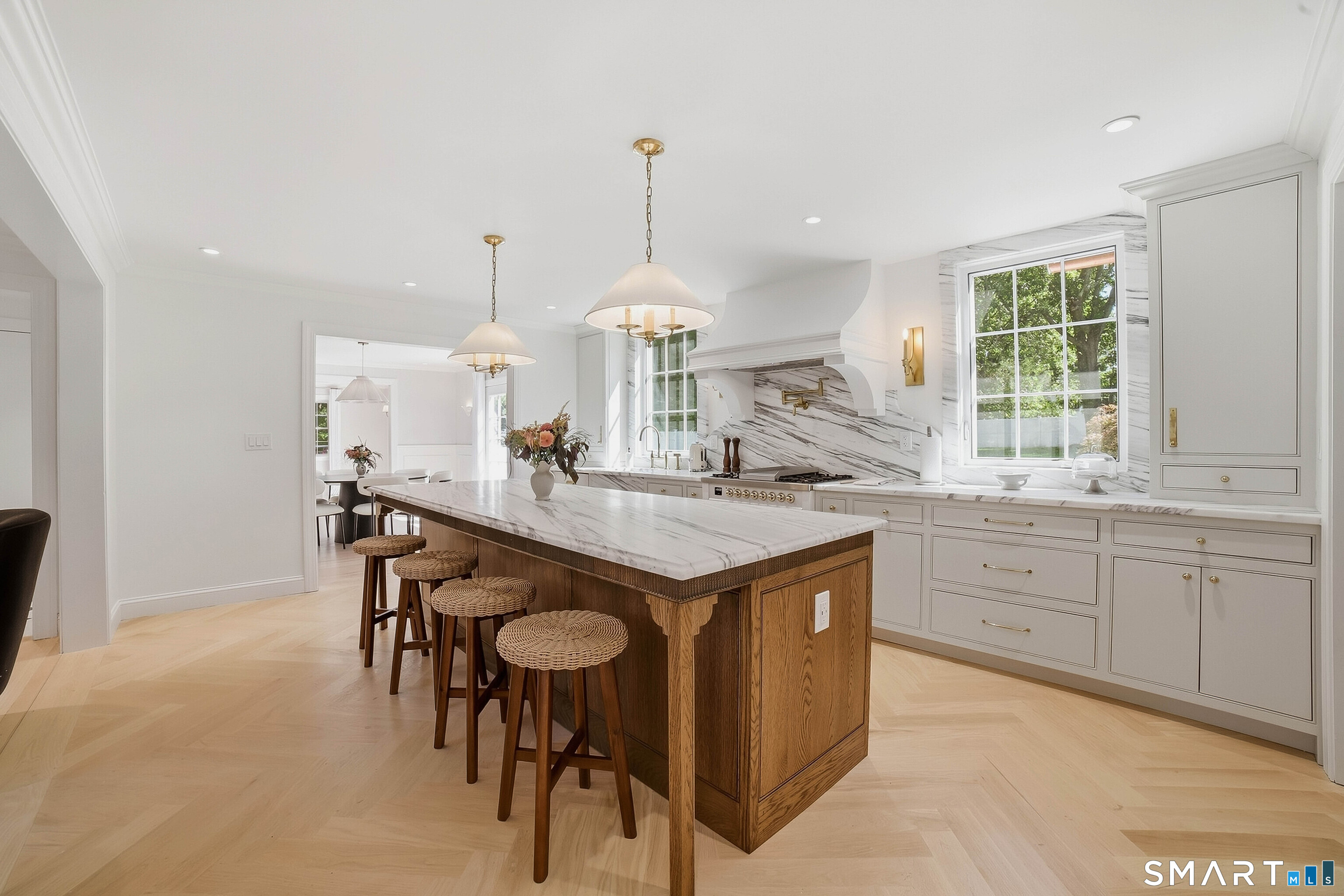 855 Prospect Street Hamden, CT 06517 - Photo 9 of 35 Calcutta marble counters offer excellent work spaces and the center island has an overhang for stools.