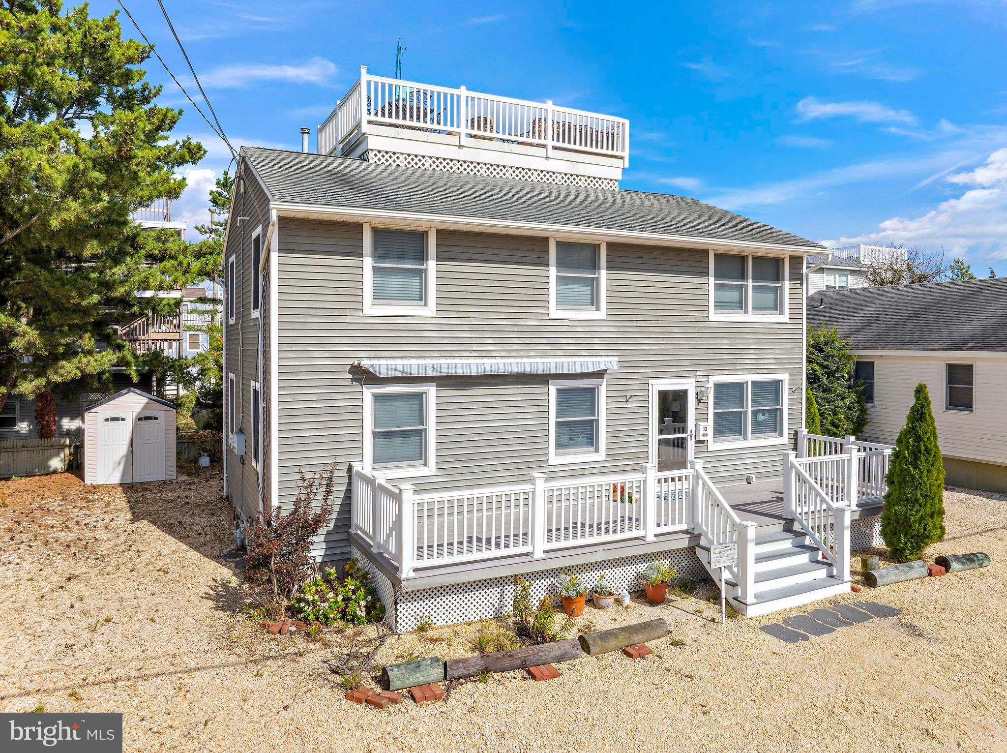 13 Joan Road, Unit 2 Long Beach Township, NJ 08008 - Photo 1 of 64 a front view of a house with a yard