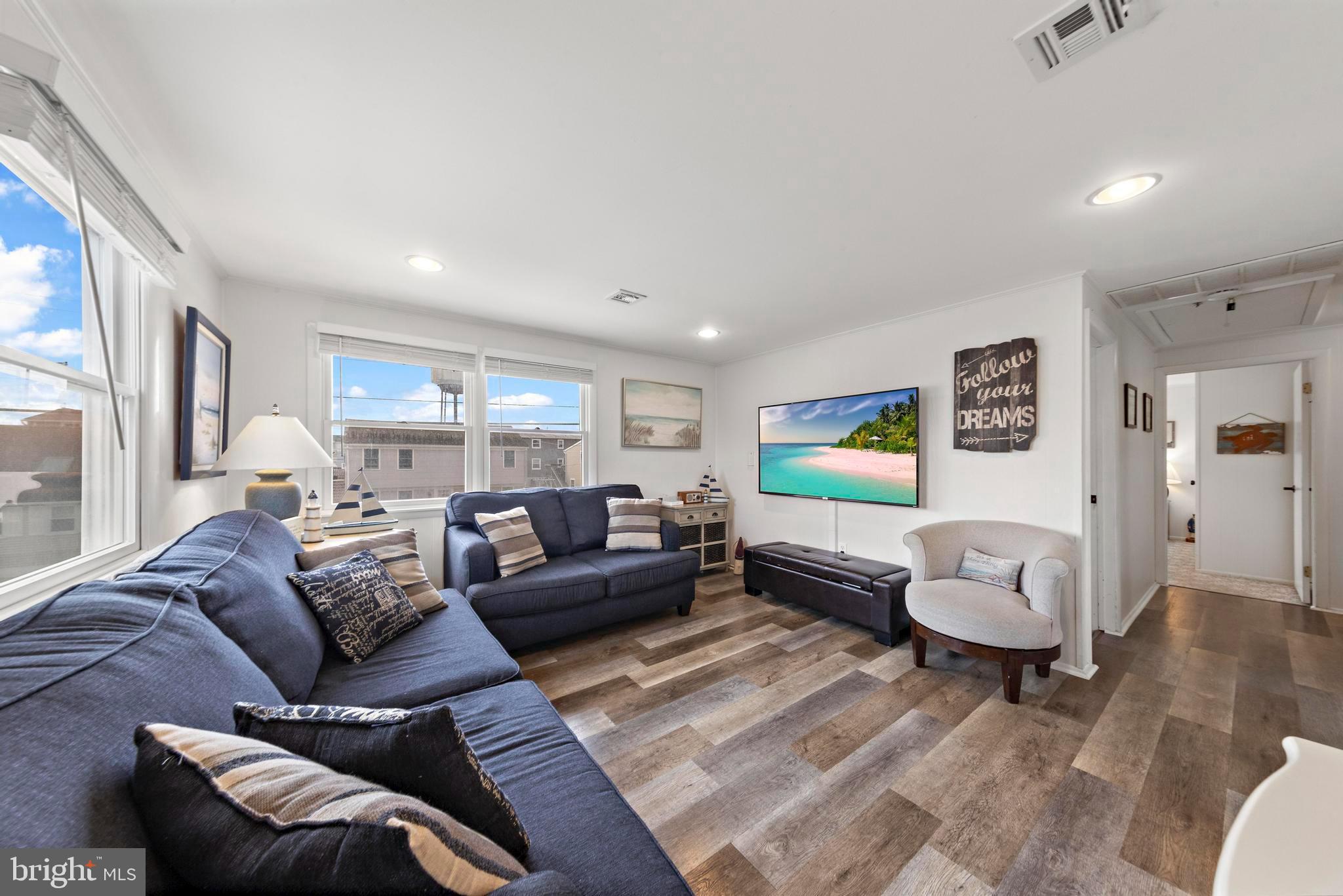 13 Joan Road, Unit 2 Long Beach Township, NJ 08008 - Photo 11 of 64 a living room with furniture and a large window