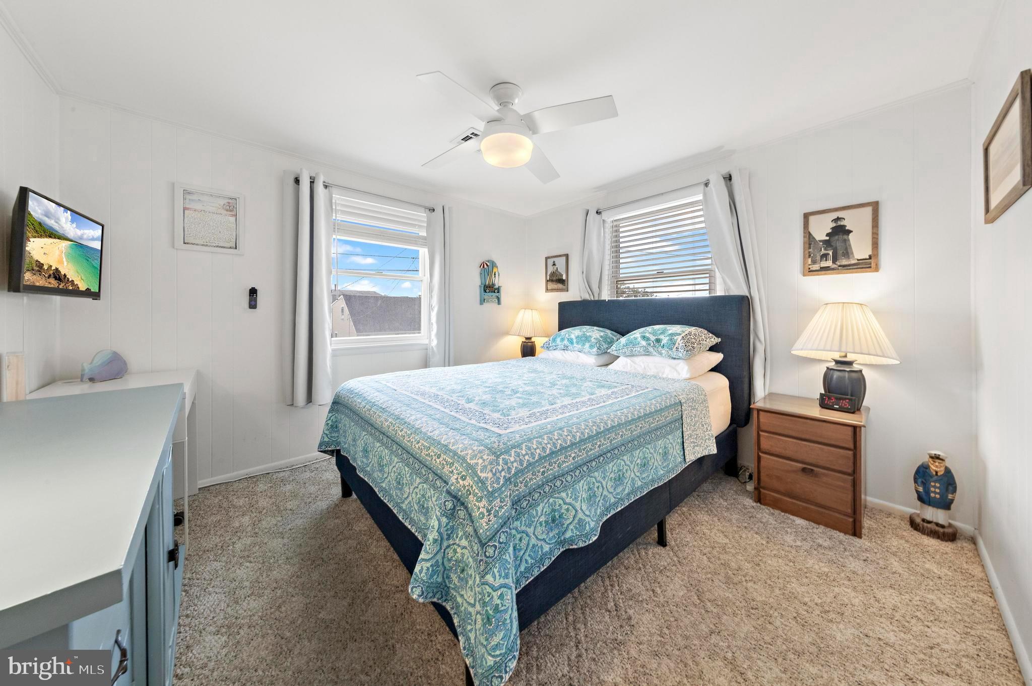 13 Joan Road, Unit 2 Long Beach Township, NJ 08008 - Photo 16 of 64 a bedroom with a bed and a desk