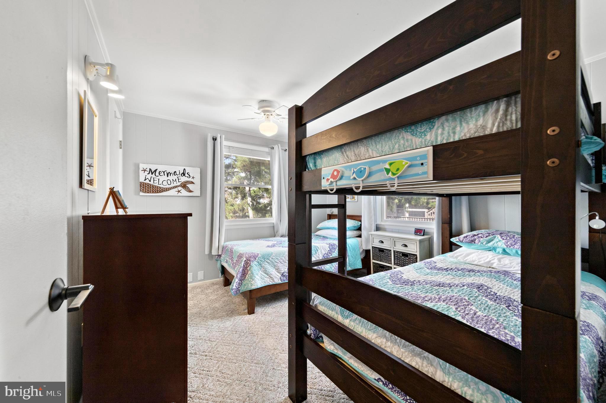 13 Joan Road, Unit 2 Long Beach Township, NJ 08008 - Photo 18 of 64 a bedroom with a bed and large windows