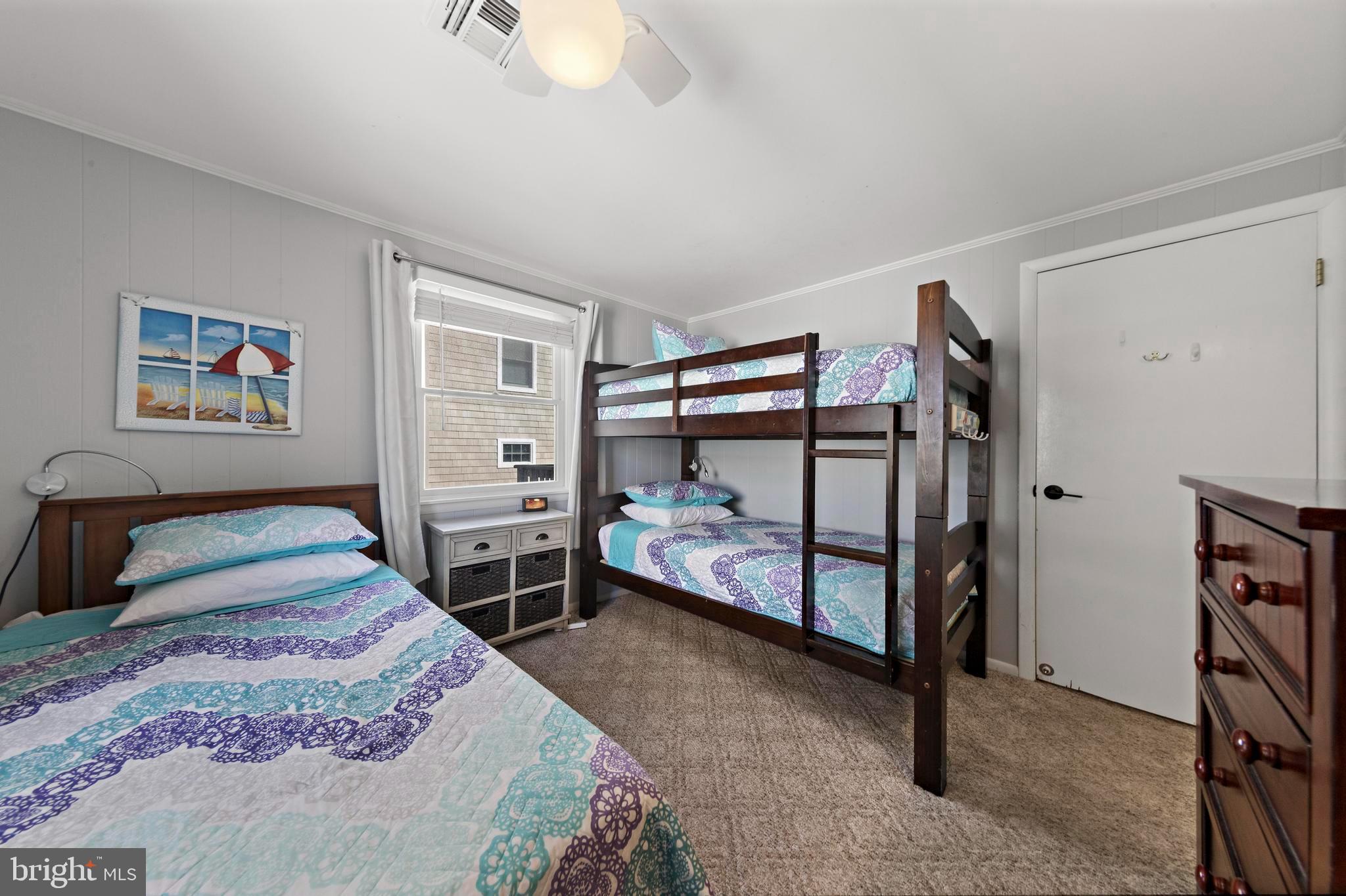 13 Joan Road, Unit 2 Long Beach Township, NJ 08008 - Photo 19 of 64 a bedroom with a bed and a window