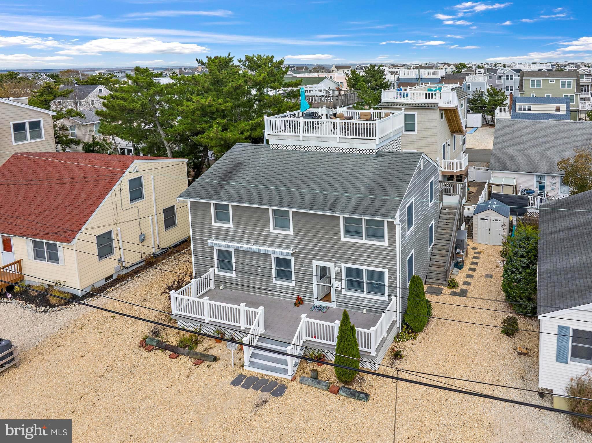 13 Joan Road, Unit 2 Long Beach Township, NJ 08008 - Photo 2 of 64 an aerial view of a house with a yard