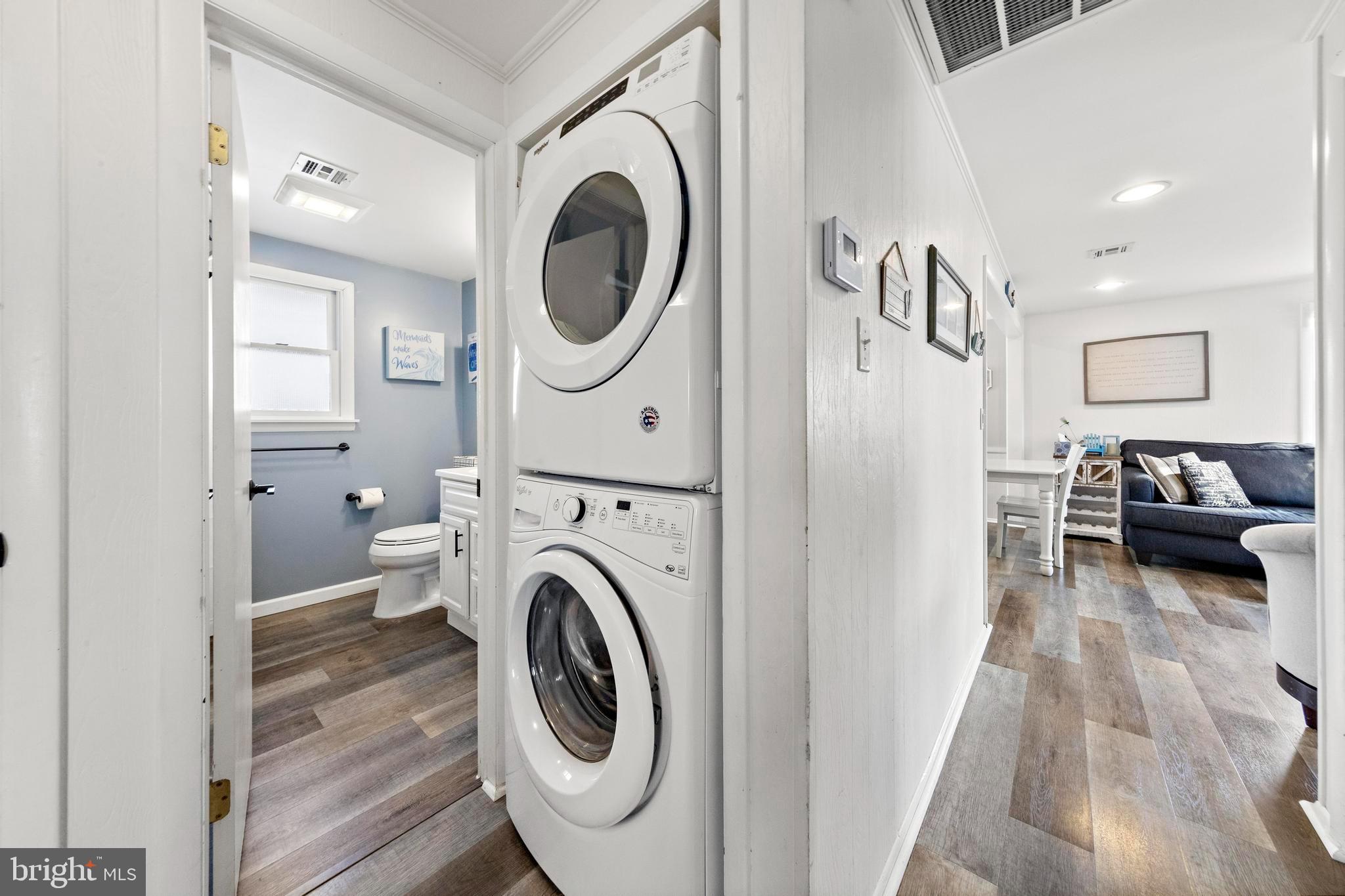 13 Joan Road, Unit 2 Long Beach Township, NJ 08008 - Photo 23 of 64 a view of a bedroom with washer and dryer