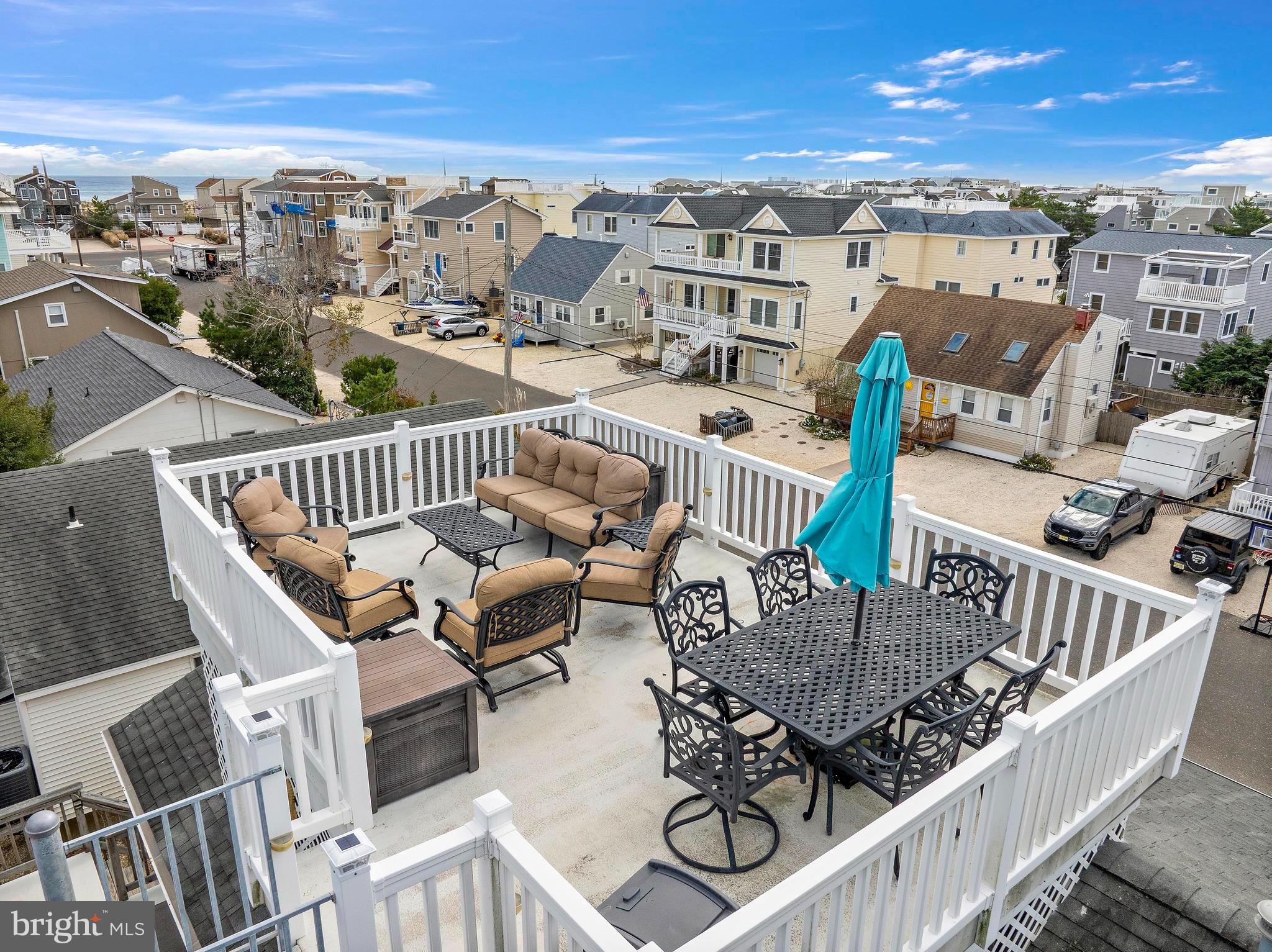 13 Joan Road, Unit 2 Long Beach Township, NJ 08008 - Photo 30 of 64 a view of a balcony with furniture