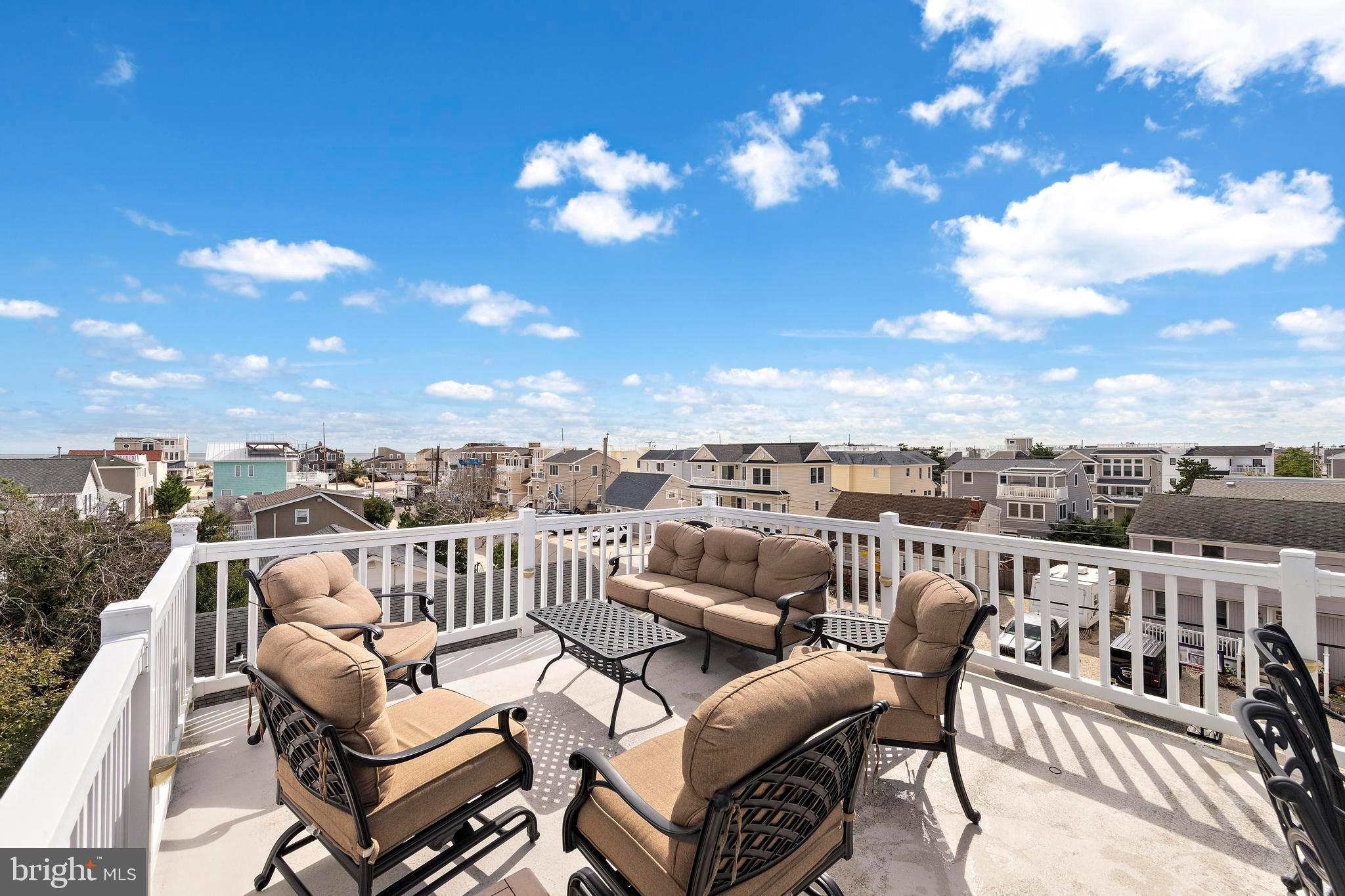 13 Joan Road, Unit 2 Long Beach Township, NJ 08008 - Photo 33 of 64 a view of a balcony with furniture