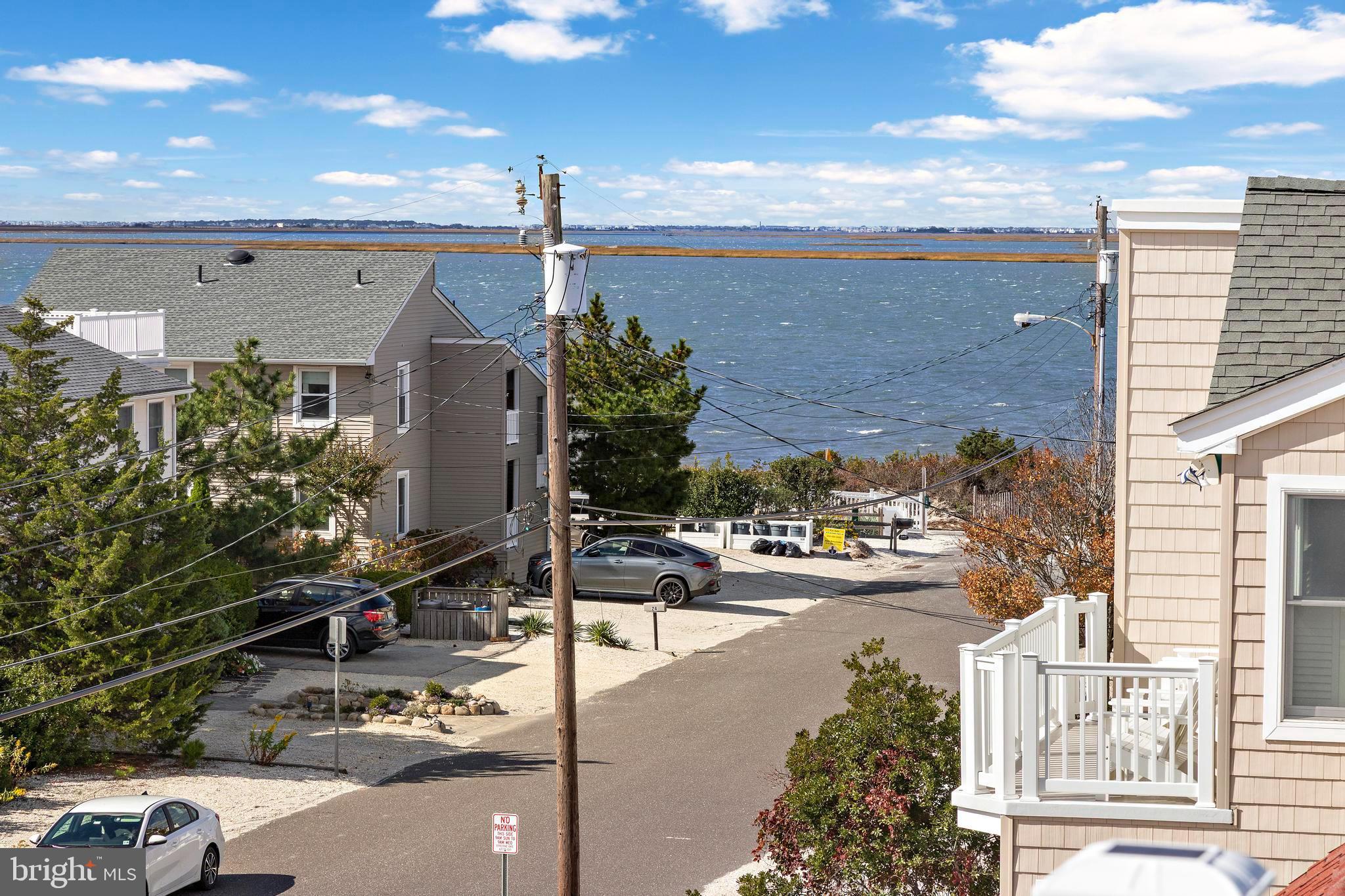 13 Joan Road, Unit 2 Long Beach Township, NJ 08008 - Photo 36 of 64 a city view with tall buildings and cars parked on road